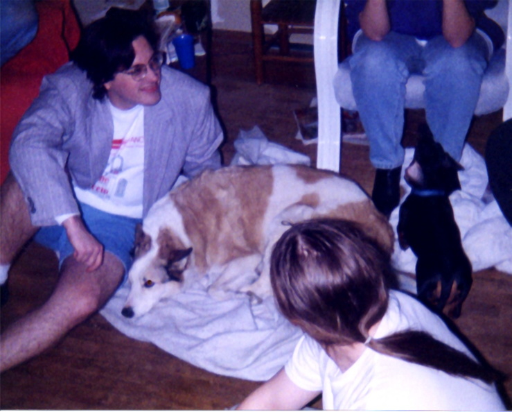 Dale consults with Koko and Nim about possible trivia answers, while Laurie looks on.
