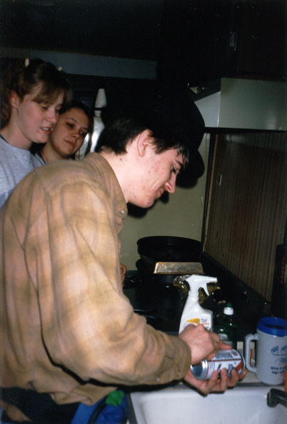 Mark preparing a Pabst Blue Ribbon for shotgunning