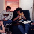 Gretchen, Glen and Jamie look on as Randy takes a break from his physics to examine a toy.