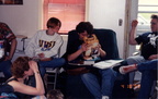 Gretchen, Glen and Jamie look on as Randy takes a break from his physics to examine a toy.