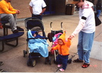 Lonnie takes Shanah for a walk, While Alex looks on.  Sam is looking on too, but she's behind Lonnie.