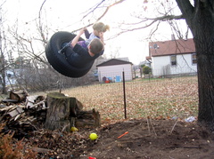 Harry and Lonnie seeing just how high the tire swing can go.  (Photo by The Kids)