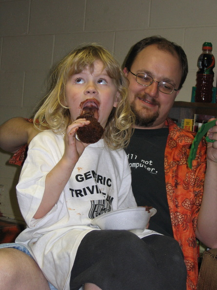 Lonnie enjoy's one of the yummy cupcakes JoAnn brought. Andy enjoys watching Lonnie eat the cupcake.