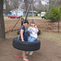 Kayla and Sam on the tire swing.