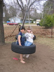 Kayla and Sam on the tire swing.