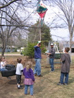 John and Lydia brought a pinata for the kids to hit! John and Melvin are setting it up as some of the kids look on.