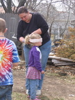 Joyce blindfolds Lonnie for his turn at the pinata.