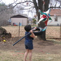 Kayla attacks the pinata.