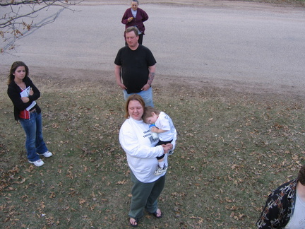 Ashley, Rob, and JoAnn holding Aylin as seen from the top of the box.
