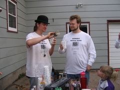 Mark pours himself and Ian some more, while Lonnie looks on.