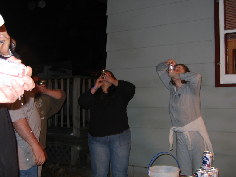 Joyce and Shannah shotgunning beer.