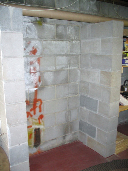 The alcove with the shelves, braces, and bolts removed