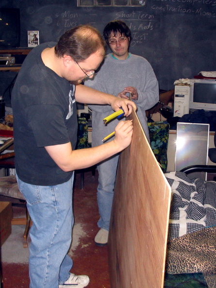 Dale helping me measure the back panel for the shelves