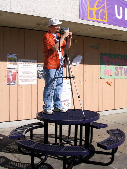 Endo got this picture of me filming the parade.  (The crowd was blocking my shots.  This worked.)