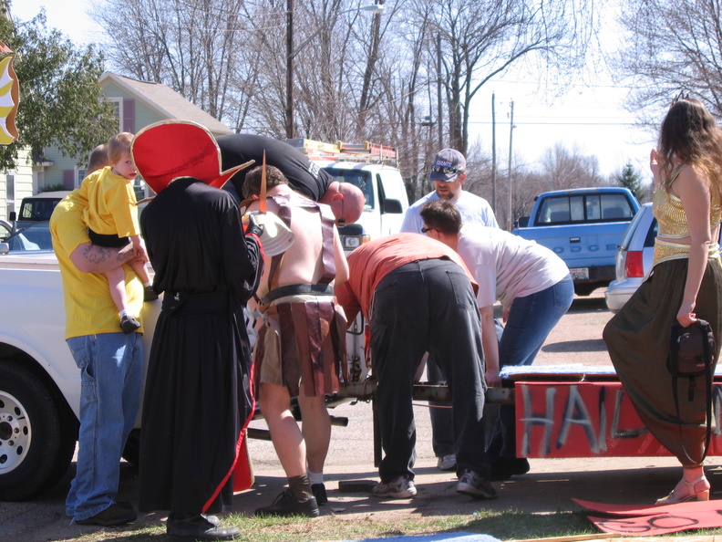 Everyone helping to hook the trailer up to the truck.