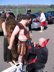 Dawn and Mark help Pat with the finishing touches to his costume.