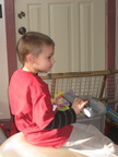 Alex having a ball, on the yoga ball, with the remote