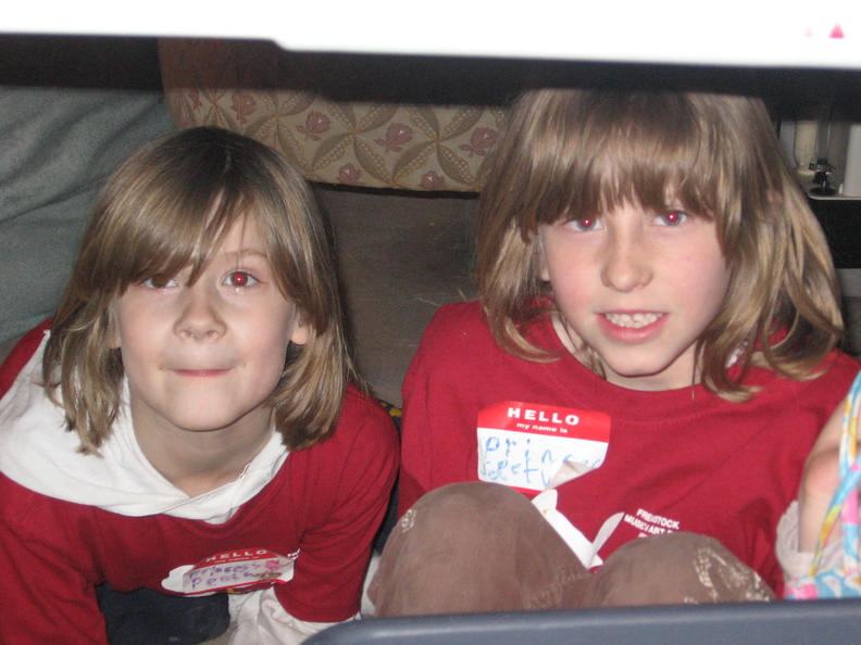 Lonnie and Sam, hiding under the table.