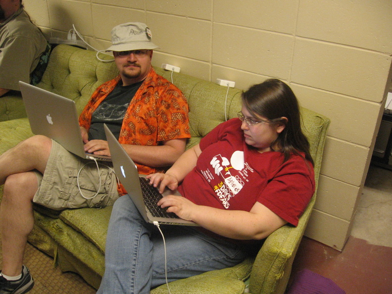 I like the way the power cords are sitting on the top of the couch, overlooking Andy and Saryn surfing.