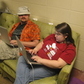 I like the way the power cords are sitting on the top of the couch, overlooking Andy and Saryn surfing.